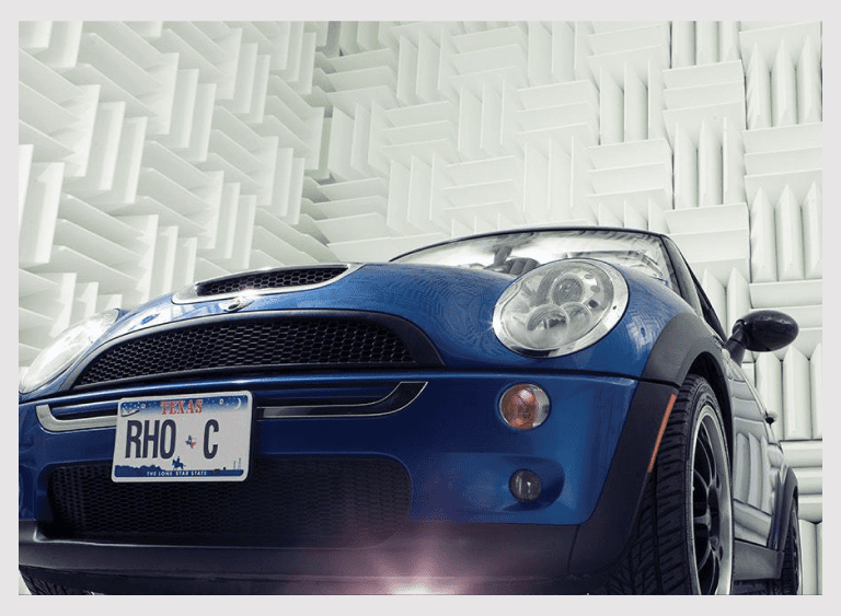 Front view of blue car indoors