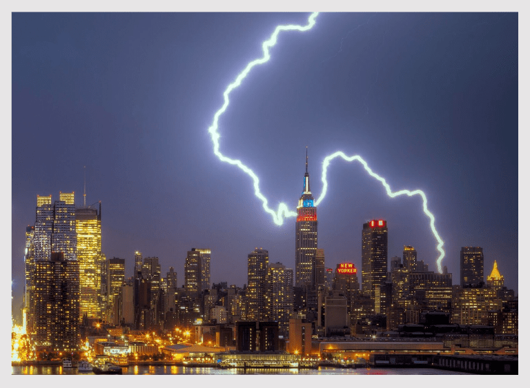 Thunderstorm illuminating urban skyscrapers