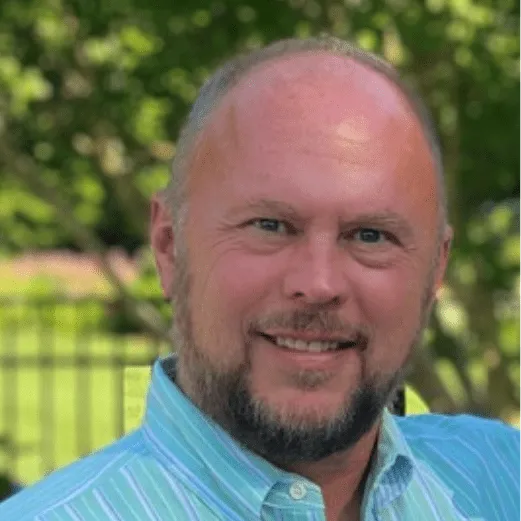 Smiling man in a striped shirt