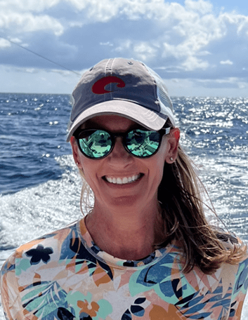 Woman wearing sunglasses at sea
