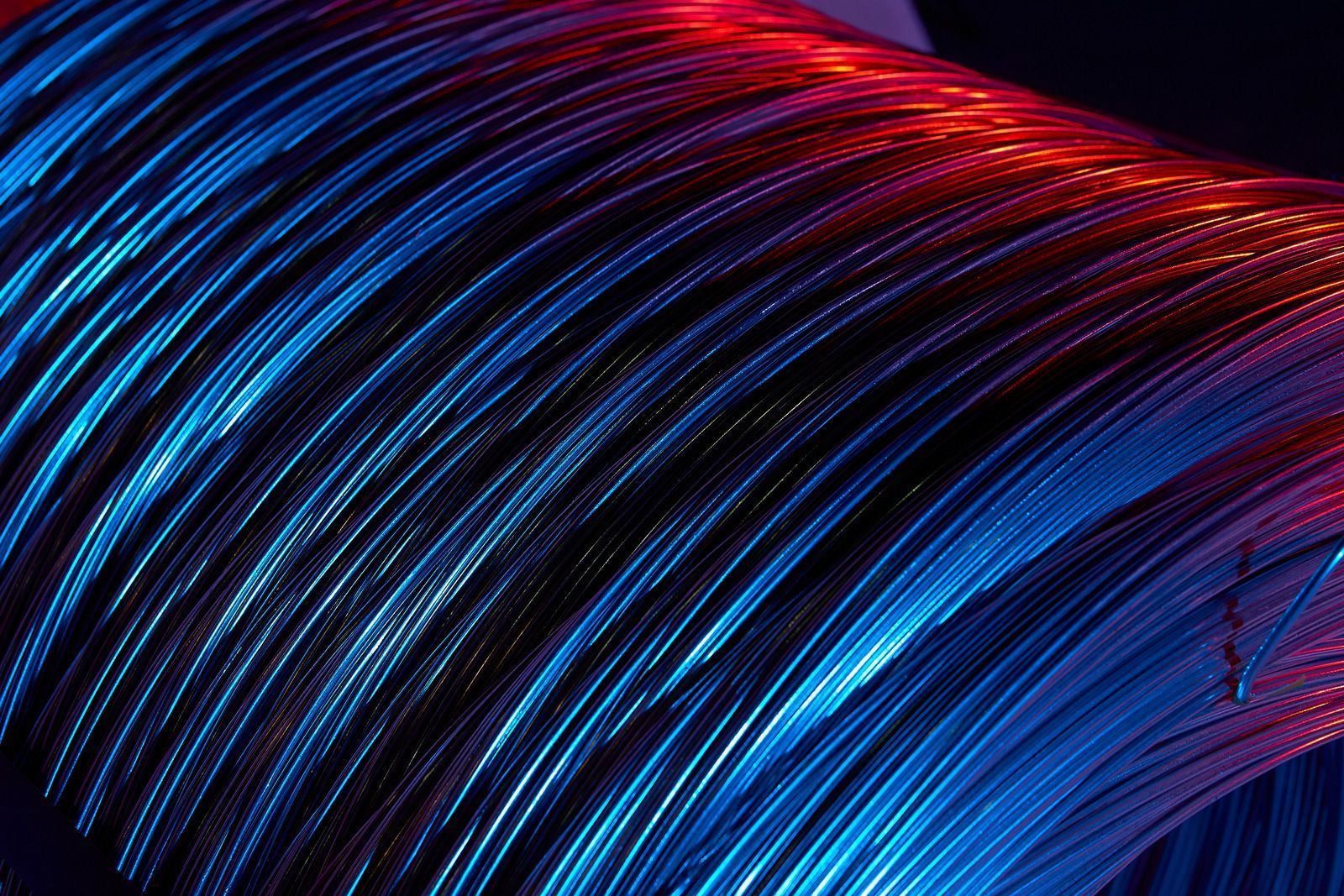 Colorful illuminated wires in darkness