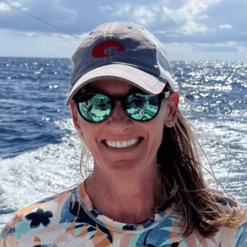 Woman wearing sunglasses at sea